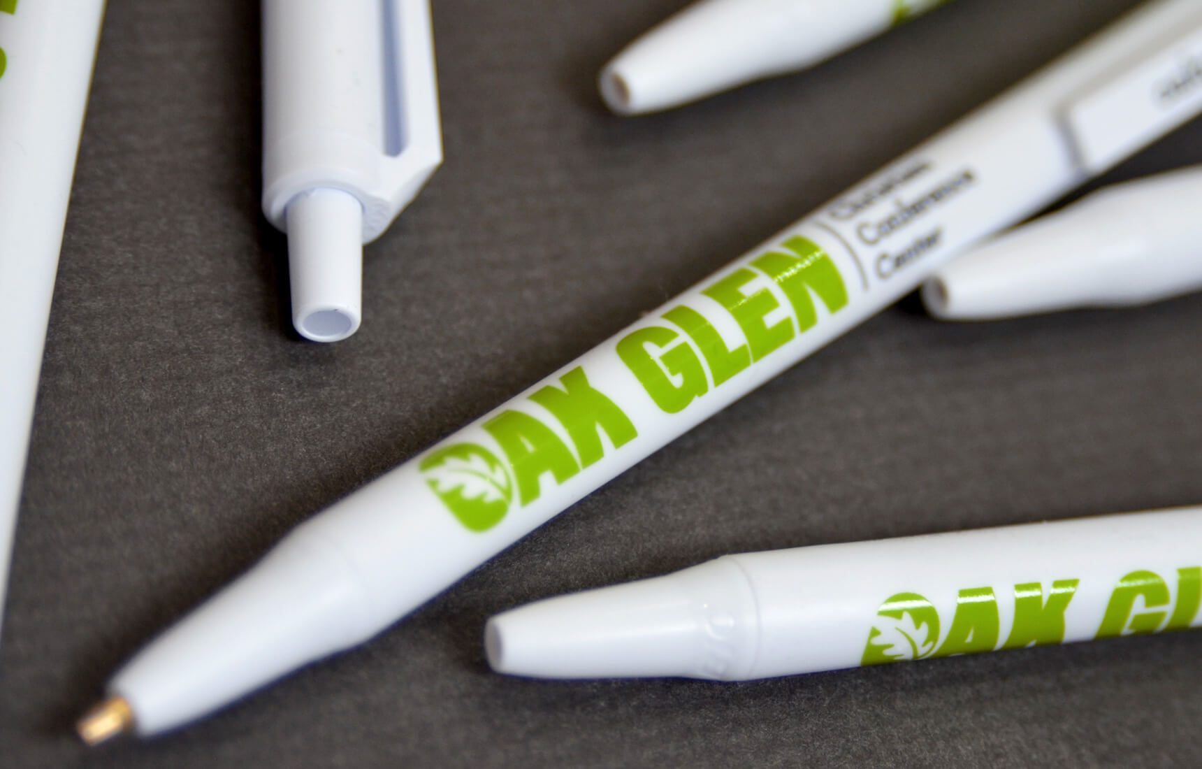 Pens with cap logo on them.